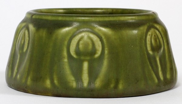 ROOKWOOD POTTERY BOWL 1919: ROOKWOOD POTTERY BOWL, 1919, H 1 3/4", DIA 3 3/4":Round pottery bowl with flaring sides, stylized tulip motif about, olive green glaze, impressed markings underneath, including 1674 and date mark for 