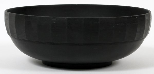 WEDGWOOD KEITH MURRAY DESIGN BLACK BASALT BOWL: WEDGWOOD KEITH MURRAY DESIGN BLACK BASALT BOWL, DIA 9":Round bowl with multi-faceted border panels, "Wedgwood, Made in England" impressed and printed marks underneath (see additional photo).