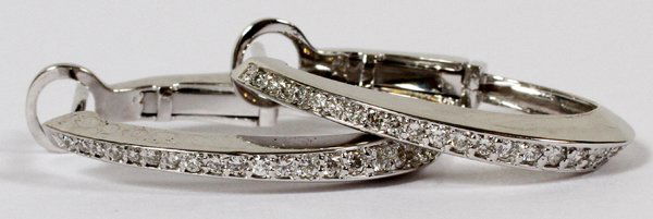 0.60CT DIAMOND & GOLD LADY'S EARRINGS PAIR: 0.60CT DIAMOND & GOLD LADY'S EARRINGS, PAIR, L 1":14kt white gold ladies earrings, featuring 0.60 carats of round diamonds lining the front. Measuring L. 1", with a total approximate weight of 4.7 gra