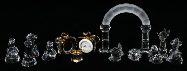 SWAROVSKI CRYSTAL FIGURINES & BOUDOIR CLOCK 13 PC: SWAROVSKI CRYSTAL FIGURINES & BOUDOIR CLOCK, 13 PCS, H 1/2"-2":Including the Christmas manger scene, with the 3 kings, Mary, baby Jesus and an archway; together with 1 wizard figure, 1 cat, 2 mice, 1 
