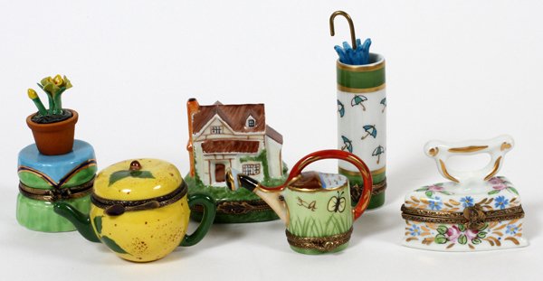 LIMOGES PORCELAIN MINIATURE BOXES SIX: LIMOGES PORCELAIN MINIATURE BOXES, SIX:Including a teapot, cottage, umbrella stand with umbrella, potted plant, watering can and urn atop a box.