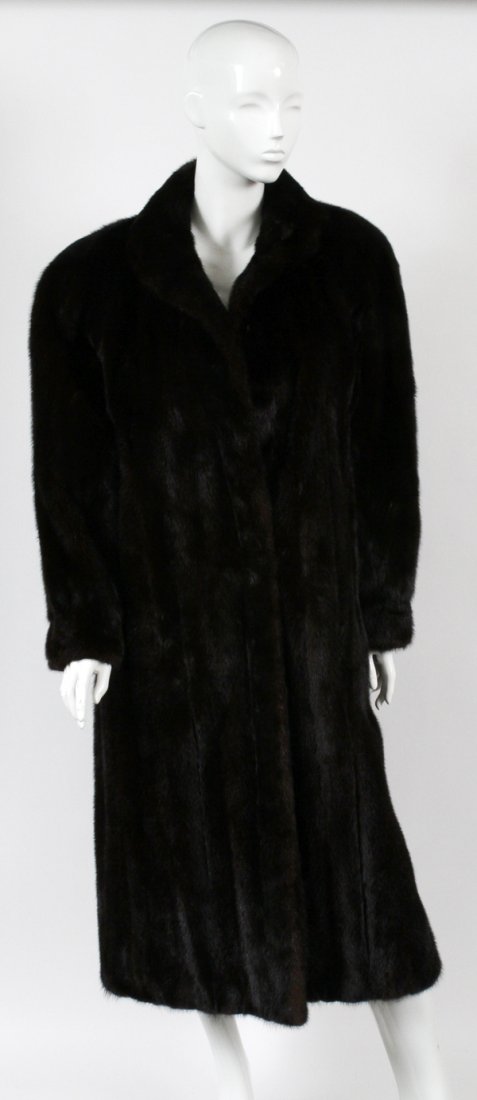 MINK COAT: MINK COAT, L 48":Black mink, long. Size 12 approx. Circa 1980. With a measuring L from shoulder to hem is 48" and sleeve L 25".