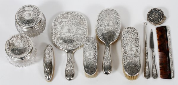 STERLING DRESSER SET ELEVEN PIECES: STERLING DRESSER SET, ELEVEN PIECES:Two dresser jars, one buffer, one pill box with mesh pocket, three blushes, one mirror, one comb, one button hook and one file.