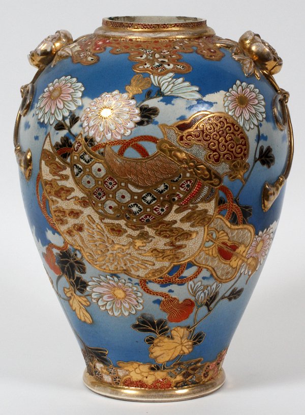 JAPANESE SATSUMA EARTHENWARE URN 20TH C.: JAPANESE SATSUMA EARTHENWARE URN, 20TH C., H 12" W 8 1/2":Baluster form urn, flanked by fired gold floral forms in relief. Measuring H. 12" x 8 1/2", no apparent markings.