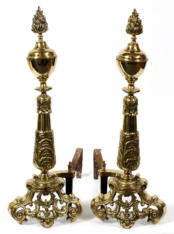 BRASS ANDIRONS PAIR: BRASS ANDIRONS, PAIR, H 23", W 7 1/2", D 18":with a flame finial, tapered shafts and pierced design scroll design bases.