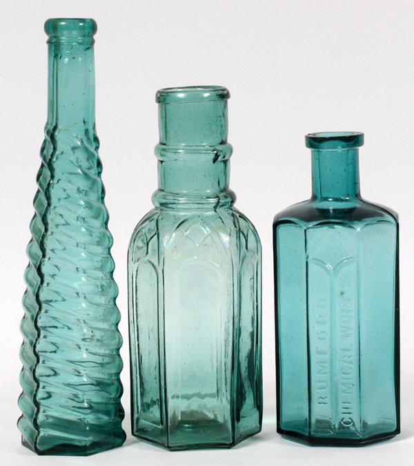 AMERICAN AQUA GLASS BOTTLES THREE: AMERICAN, AQUA GLASS BOTTLES, LATE 19TH-EARLY 20TH C., THREE, H 6" & 8":Including 1 Rumford Chemical Works paneled bottle, H.6", 1 bottle with spiraled ribs about the hexagonal body, marked "S. & P. P