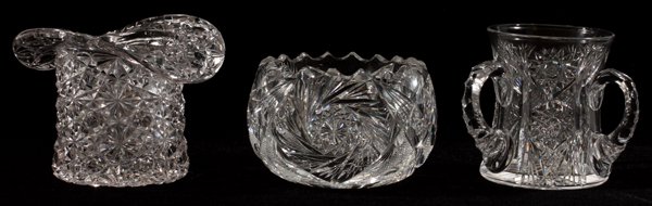 AMERICAN BRILLIANT CUT GLASS BOWLS & LOVING CUP: AMERICAN BRILLIANT CUT GLASS BOWLS & LOVING CUP, C. 1900, THREE, H 3"-4":Including 1 top hat-form bowl cut in the Russian pattern, measuring H.4"; together with 1 waste bowl, decorated with pinwheel m