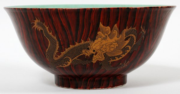 CHINESE PORCELAIN BOWL: CHINESE PORCELAIN BOWL, H 4", DIA 8.75":Having a green interior with all around dragon design on the exterior. Mark on the underside.