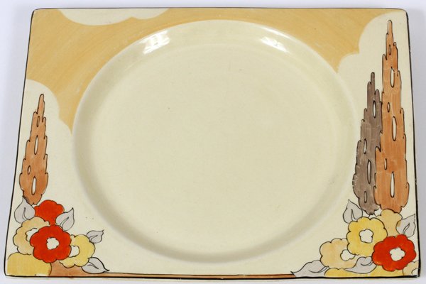 CLARICE CLIFF HAND PAINTED 'BIZARRE' PLATE: CLARICE CLIFF HAND PAINTED 'BIZARRE' PLATE, MID 20TH C., L 10 1/4":Rectangular form plate, decorated in floral and tree motif, stamped at the reverse. Measuring L.10 1/4" x 8 1/4". Mid 20th Century.
