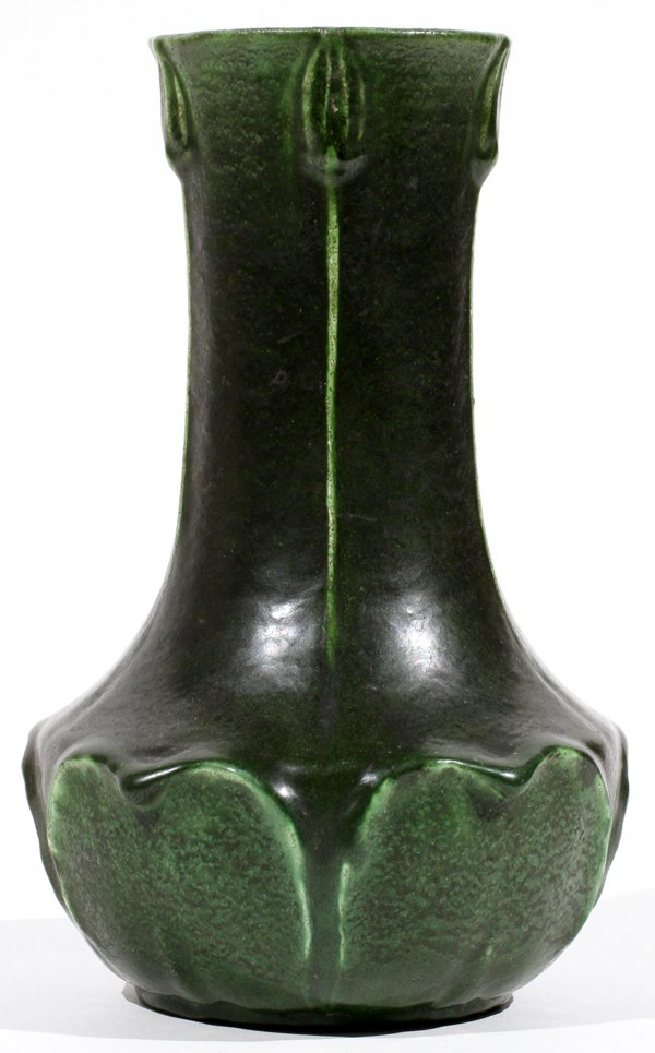 GRUEBY FAIENCE CO. POTTERY VASE BOSTON C. 1900: GRUEBY FAIENCE CO. POTTERY VASE, BOSTON, C. 1900, H 8":Stylized water lily motif with matte green glaze. Impressed circular stamp and triangle underneath (see photo). Measuring H.8", early 20th Centur