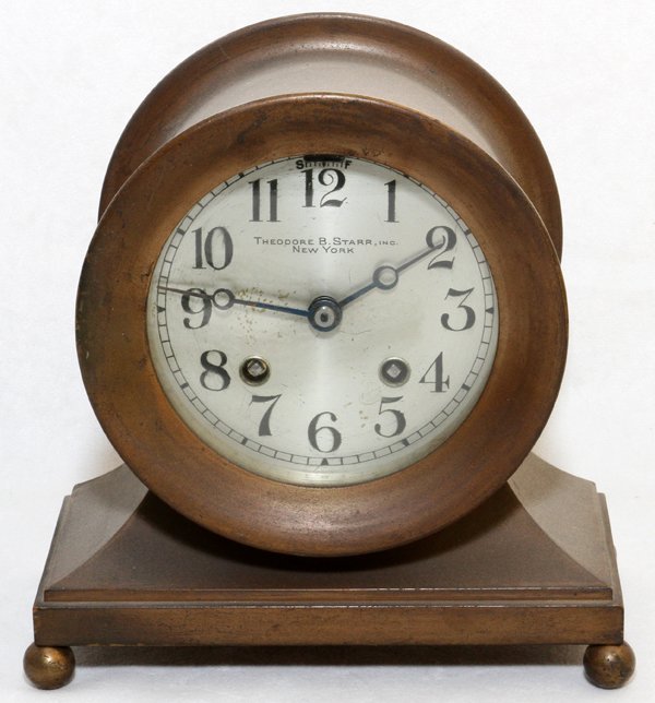 THEODORE B. STARR OF NEW YORK BRONZE SHIP'S CLOCK: THEODORE B. STARR OF NEW YORK BRONZE SHIP'S CLOCK,:On ball feet.