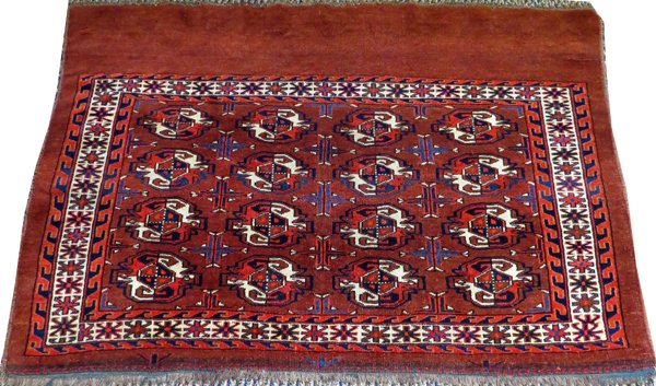 TEKKE RUSSIAN RUG ANTIQUE: TEKKE RUSSIAN RUG, ANTIQUE, 4' 0" X 2' 6":Red ground.