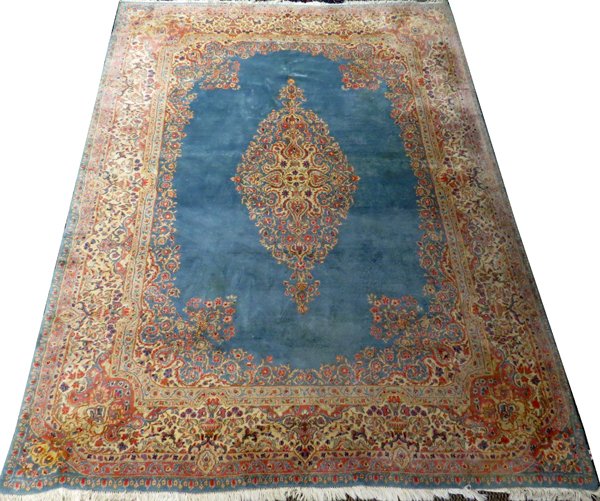 PERSIAN KERMAN ORIENTAL RUG: PERSIAN KERMAN ORIENTAL RUG 12' X 8'10":Hand woven, all wool. Circa 1960. Light blue field, medallion center, floral border in pale colors of rose and beige.