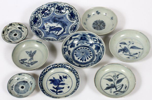 EARLY CHINESE BLUE & WHITE SMALL BOWLS 9 PCS: EARLY CHINESE BLUE & WHITE SMALL BOWLS, 9 PCS, DIA 2 1/2" - 5":nine bowls in blue and white depicting floral designs and one with a deer in the well.