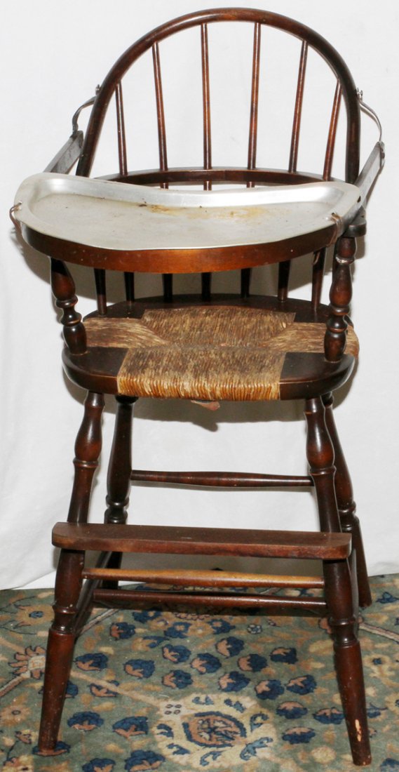 EARLY AMERICAN STYLE WINDSOR BACK HIGH CHAIR: EARLY AMERICAN STYLE, WINDSOR BACK, HIGH CHAIR H 35":It has detachable metal tray, woven rush seat.