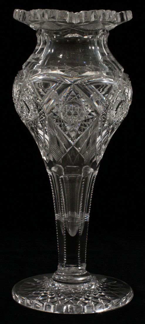 J. HOARE & CO. AMERICAN BRILLIANT CUT GLASS VASE: J. HOARE & CO. AMERICAN BRILLIANT CUT GLASS VASE, C. 1900, H 10", DIA 4":Footed form vase with a flared rim and serrated edge. Brilliant cut decorated with chain of hobstars. No apparent markings to t