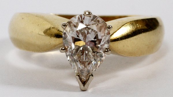14KT YELLOW GOLD &1.2 CT DIAMOND RING: 14KT YELLOW GOLD &1.2 CT DIAMOND RING:A 14kt gold and pear shape diamond ring. Ring size 6 1/2. Having an approximate total weight of .28 ounces.SI1,J color