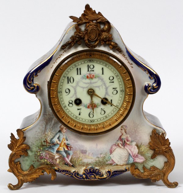 MARTI ET CIE. FRENCH PORCELAIN MANTEL CLOCK: MARTI ET CIE., FRENCH PORCELAIN MANTEL CLOCK, H 10", W 9":Courting scene with bronze ormolu. Arabic numerals with a two key wind. Measures H.10" x 9" x 4".