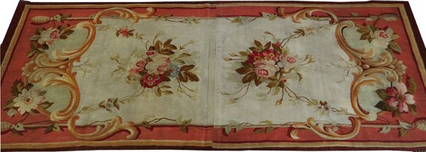 FRENCH AUBUSSON RUG C. 1900: FRENCH AUBUSSON RUG, C. 1900, 8' 8" X 3' 3":Decorated with two central floral bouquets on a pale green ground. Measuring L. 8 ft. 8 x 3 ft. 3. Circa 1900.