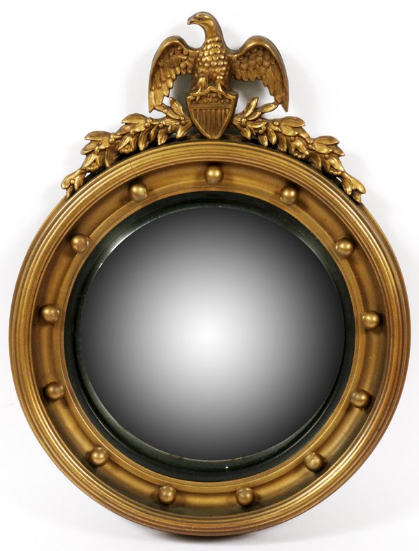 FEDERAL STYLE GILT WOOD & EBONIZED CONVEX MIRROR: FEDERAL STYLE GILT WOOD & EBONIZED CONVEX MIRROR, 20 3/4" X 16":Round form convex mirror, surmounted by a carved eagle finial. Measuring H. 20 3/4" x 16".
