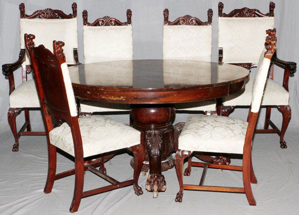 MAHOGANY DINING ROOM SUITE NINE PIECES: MAHOGANY DINING ROOM SUITE, NINE PIECES:Featuring a round pedestal base table with scroll legs, leaf forms and paw feet H 33", Dia 54". Accompanied by four leaves 13" leaves, two arm chairs and four s