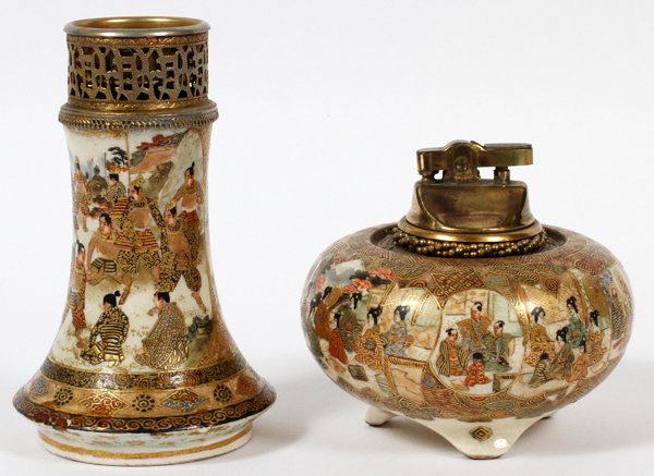 JAPANESE SATSUMA EARTHENWARE LIGHTERS TWO: JAPANESE SATSUMA EARTHENWARE LIGHTERS, TWO, H 4" & 5 1/8":Each is decorated with scenes of figures gathered, marked at the undersides. Measuring H. 4" and H. 5 1/8". Circa early 20th Century.