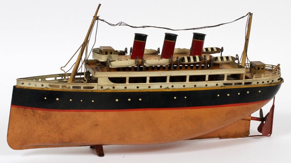 ANTIQUE PAINTED METAL TOY BOAT EARLY 20TH C.: ANTIQUE PAINTED METAL TOY BOAT, EARLY 20TH C.:Decorated in tan, red, cream, and black. Circa early 20th Century.
