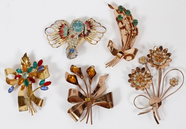 CORO CRAFT STERLING BROOCH COLLECTION FIVE PIECES: CORO CRAFT STERLING BROOCH COLLECTION, FIVE PIECES:Including a leaf and ribbon form brooch with green and clear stones, L 3 1/8", flower and leaf form brooch with amber colored and clear stones, L 3",