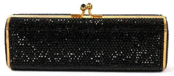 JUDITH LEIBER BLACK FULL BEAD MINAUDIERE: JUDITH LEIBER BLACK FULL BEAD MINAUDIERE, W 6 1/4":Oblong hexagonal shape with black crystals overall, the clasp inset with black cabochons, opening to gold leather lining, mirror and comb. Stamped: J
