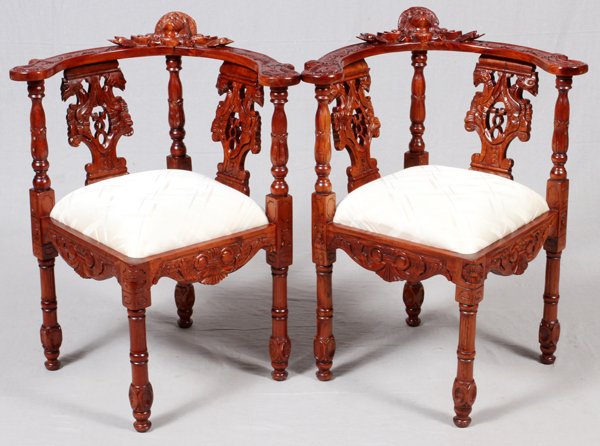 RENAISSANCE REVIVAL STYLE CARVED CORNER CHAIRS PAIR: RENAISSANCE REVIVAL STYLE CARVED CORNER CHAIRS, PAIR, H 34 1/4":Carved wood frame with mahogany finish.