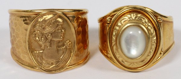 14KT YELLOW GOLD RINGS TWO: 14KT YELLOW GOLD RINGS, TWO:Including 1 cabochon moonstone and 1 a profile oval medallion. Both are marked 14KT. Totaling approximately 9 grams.