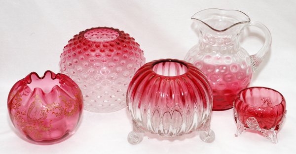 VICTORIAN CRANBERRY GLASS ROSE BOWLS& A PITCHER: VICTORIAN CRANBERRY GLASS ROSE BOWLS (4) & A PITCHER, LATE 19TH C., H 3"-7 1/2":Including 4 cranberry glass rose bowls, three of which shade to clear, the other with enameled bird and scroll motif; to
