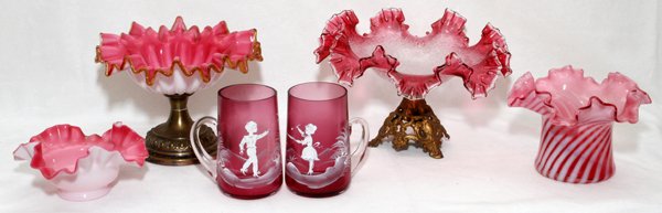 VICTORIAN CRANBERRY GLASS COMPOTES VASES & MUGS: VICTORIAN CRANBERRY GLASS COMPOTES, VASES & MUGS, LATE 19TH C., H 3"-5":Including 2 compotes, each has a gilt metal base; 1 round bowl; 1 opalescent swirl vase; and a set of 2 Mary Gregory style mugs.