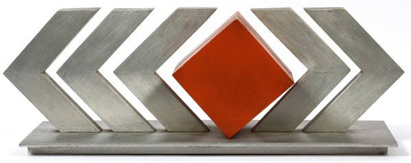 HANNA STIEBEL ALUMINUM ABSTRACT SCULPTURE: HANNA STIEBEL ALUMINUM ABSTRACT SCULPTURE, H 10", L 27" (AMERICAN, 1923-2005):Signed, Hanna Stiebel. Orange cube centered by "V" shapes