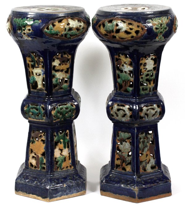 CHINESE GLAZED POTTERY PLANT STANDS 19TH C. PAIR: CHINESE GLAZED POTTERY PLANT STANDS, 19TH C. PAIR H 26 1/2" DIA 12 1/2":Having reticulated panels depicting glazed flowers and urns throughout. Deep blue ground with green white, and burnt orange glaz