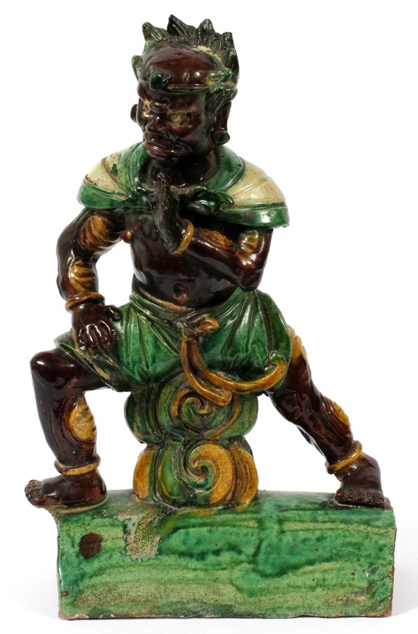 CHINESE GLAZED POTTERY ROOF TILE 19TH C.: CHINESE GLAZED POTTERY ROOF TILE 19TH C. H 15" L 8 1/2":Depicting a god to ward off evil spirits