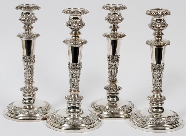 ENGLISH SHEFFIELD PLATE CANDLESTICKS LATE 19TH C.: ENGLISH SHEFFIELD PLATE CANDLESTICKS, LATE 19TH C., SET OF 4, H 11":A set of four Sheffield plate single candlesticks, decorated with bands of scrolling acanthus leaf and shell designs, measuring H. 1
