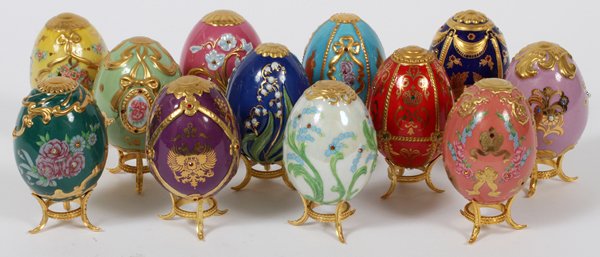 FRANKLIN MINT 'FABERGE IMPERIAL' PORCELAIN EGGS: FRANKLIN MINT 'FABERGE IMPERIAL' PORCELAIN EGGS, SET OF TWELVE, H 3":Each is uniquely decorated and raised on a gilt metal stand. For a high resolution photo CLICK
