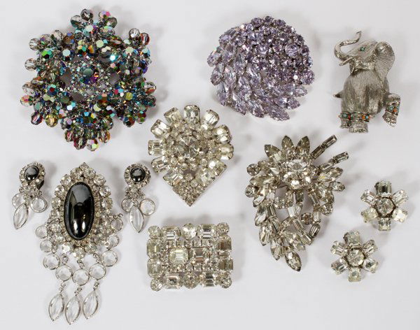 WEISS HOBE & KRAMER COSTUME JEWELRY GROUPING 9 PCS: WEISS HOBE & KRAMER, COSTUME JEWELRY GROUPING, 9 PCS:includes seven brooches/pins including one having an oval blue gray cabochon stone and matching pair of clip earrings marked 'Hobe' and a second br