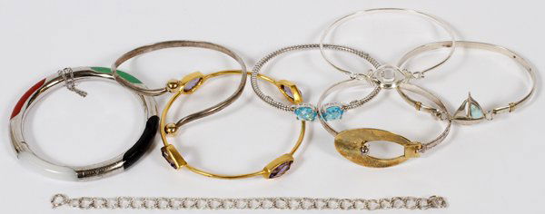 14KT GOLD& STERLING SILVER BANGLE &CHAIN BRACELETS: 14KT GOLD AND STERLING SILVER BANGLE AND CHAIN BRACELETS, 8 PCS.,:five bangle bracelets with one white gold with yellow gold spheres, marked 14kt and weighing 13 grams. Four of Sterling silver with on