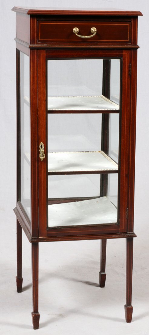 EDWARDIAN INLAID MAHOGANY VITRINE C. 1905: EDWARDIAN INLAID MAHOGANY VITRINE, C. 1905, H 45 3/4", W 15 1/2" SQ.:Fitted with a single drawer above a glass paneled door, with an interior of two shelves. Inlaid with a center medallion and banding