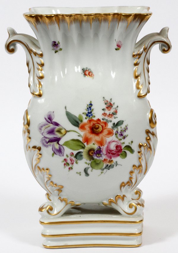 HEREND HAND PAINTED PORCELAIN VASE MID 20TH C.: HEREND HAND PAINTED PORCELAIN VASE, MID 20TH C., H 10 1/2", W 7":Footed, baluster form vase with a square base, flanked by scrolled foliate decorated handles. Hand painted with floral bouquets at eith