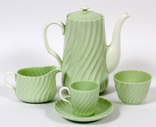 MINTON PORCELAIN DEMITASSE SET ELEVEN PIECES: MINTON PORCELAIN DEMITASSE SET, ELEVEN PIECES:The Minton demitasse set is pale green in color, with white handles, and consists of a coffee pot, creamer, open sugar and eight cups and saucers. For a h
