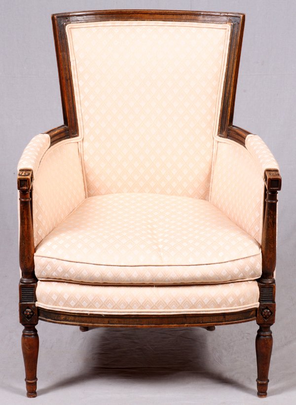 FRENCH BERGERE CHAIR ANTIQUE: FRENCH BERGERE CHAIR, ANTIQUE, H 40":Raised on baluster form legs, with diamond and floral decorated block supports. Upholstered in a light peach silk upholstery. For a high resolution photo