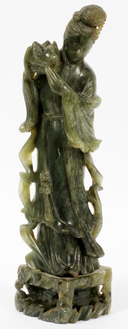 CHINESE SOAPSTONE FIGURE OF GUAN YIN: CHINESE SOAPSTONE FIGURE OF GUAN YIN, H 14":Carved standing figure depicted holding a lotus blossom. For a high resolution photo CLICK HERE