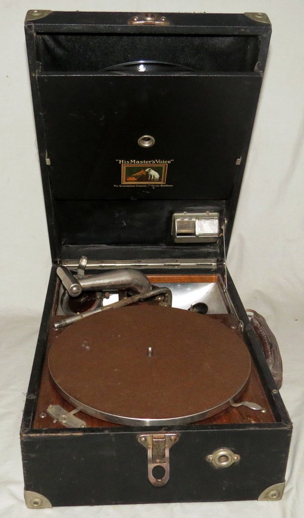 MASTERS VOICE GRAMOPHONE CO WIND UP RECORD PLAYER: MASTERS VOICE GRAMOPHONE CO WIND UP RECORD PLAYER C1920:Portable record player, inscribed on inside of lid "His Master's Voice", "The Gramophone Company 1st. Hayes, Middlesex". With black hinged case