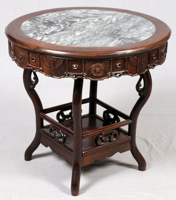 CHINESE MARBLE TOP TEAKWOOD 19TH.C. TABLE: CHINESE MARBLE TOP TEAKWOOD 19TH.C. TABLE, H 31", DIA 32":A round teakwood table, with an inset marble top, raised on four legs, joined by a lower shelf.