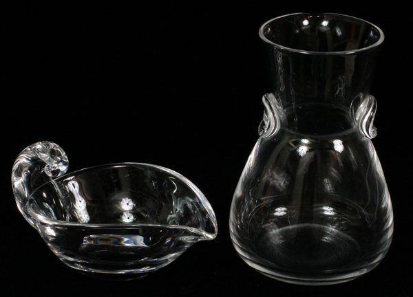 STEUBEN GLASS SAUCE DISH & COCKTAIL PITCHER TWO: STEUBEN GLASS SAUCE DISH & COCKTAIL PITCHER, TWO, H 7 1/2", L 7":Including one sauce dish, with scroll form handle, L. 7", and one cocktail pitcher, H. 7 1/2". Both are signed.