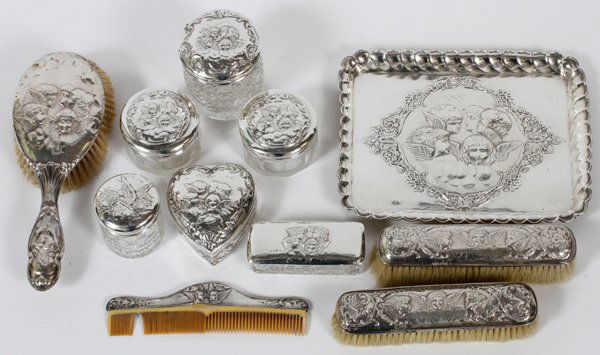 EDWARDIAN STERLING & GLASS DRESSER SET, 11 PCS.: EDWARDIAN STERLING & CUT GLASS DRESSER SET, C. 1902-06, ELEVEN PIECES, REYNOLDS' ANGELS MOTIF:Sterling silver assembled set featuring repousse Reynolds' angels motif, including, by Henry Matthews, Bir
