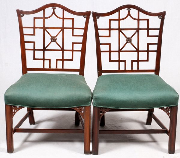 CHINESE CHIPPENDALE STYLE SIDE CHAIRS C. 1900 PAIR: ENGLISH CHINESE CHIPPENDALE STYLE SIDE CHAIRS, C. 1900, PAIR, H 37":Having arched form crests, with fretwork decorated backs, raised on straight legs, with green upholstered seat cushions.